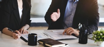 Consulting, male advisor pointed to company financials