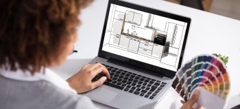 Female Architect Working On Color Selection For The Kitchen
